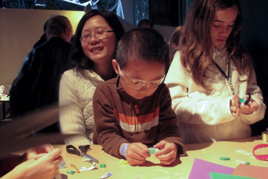 Young people and caregivers play and learn together at the Exploratorium
