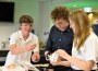 Teenagers attending a technology workshop